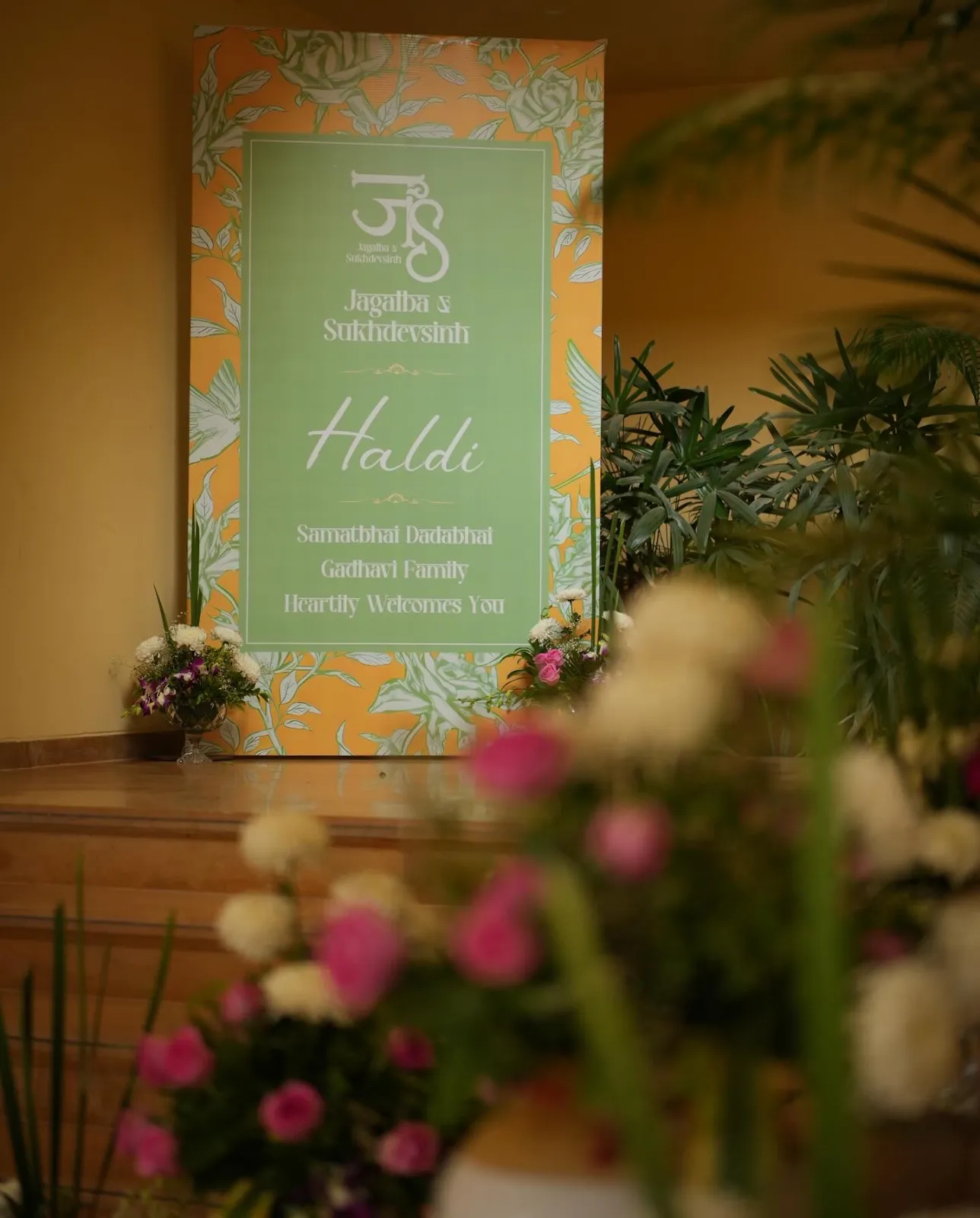 Custom illustrated welcome signage framed by flowers